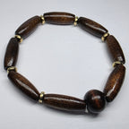Brown beaded bracelet on a light gray background