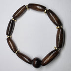 Wooden beaded bracelet on a light gray background